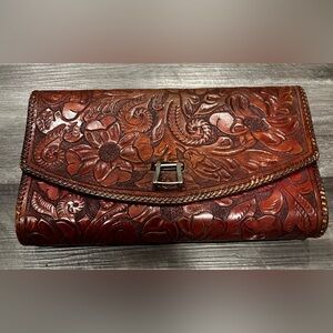 Floral Embossed Brown Leather Clutch. Vintage not sure of eara.